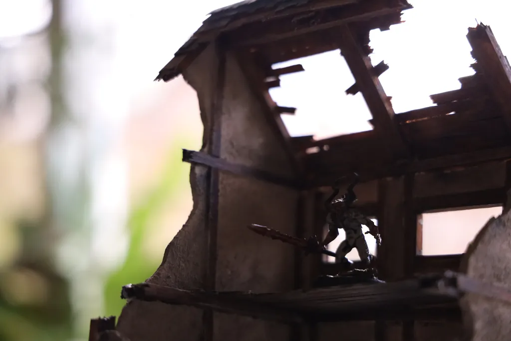 A miniature figure in the ruined house of a diorama